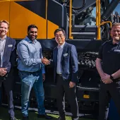 Rygor Group commercial director Rish Channa (centre left) and Chase Shim, managing director of Hyundai Construction Equipment Europe (centre right), shake hands on the appointment of Rygor Plant at the Bauma fair in Munich, with Bart van Berkel, network excellence development (left) and Anthony Hogben, regional sales manager (right)