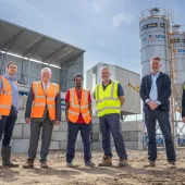 L–R: Prof. David Hughes; Bob Borthwick; Scott Bros recycling innovation engineer Feysal Shifa; Peter Scott; Joss Newberry; and Cassidy Smith, Teesside University’s IP and commercialization manager, at the low-carbon concrete plant
