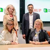Signing of the Memorandum of Understanding between Heidelberg Materials and Arup. Seated (L-R): Dame Jo da Silva, chief sustainable development officer, Arup; and Dr Katharina Beumelburg, chief sustainability and new technologies officer, Heidelberg Materials. Standing (L-R): Jemima Bruin-Bland, carbon capture and utilization lead - UKIMEA, Arup; and Mubarik Chowdhry, vice-president of global key account and product management for evoZero, Heidelberg Materials