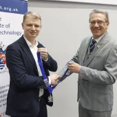 L-R: John Reddy receiving the ICT President’s chains of office from outgoing President Colin Nessfield