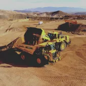 An autonomous Komatsu HD605-10 rigid dumptruck being loaded at Komatsu’s Arizona proving grounds