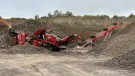 A Screencore XJ jaw crusher , Trident 124 scalper and 380DD stacker conveyor production train