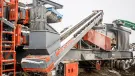 The patented recirculation conveyor on the portable Sentry HSI plant from Superior