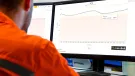 An engineer remotely monitors the cyclic loading of a bolted connection