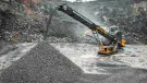 Screencore 365 stockpiler in WBI Baumaschinen livery receiving feed from a primary crusher
