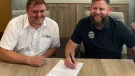 L-R: Finlay general manager and business line director Matt Dickson with Mike Maher, founder and chief executive officer of ProTrack, signing the new dealership agreement