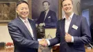 L-R: Ming XU, senior vice-president of SANY Group, and Alexander Scott, chief executive officer of TH White Group, at the signing ceremony marking the formal agreement between the two organizations
